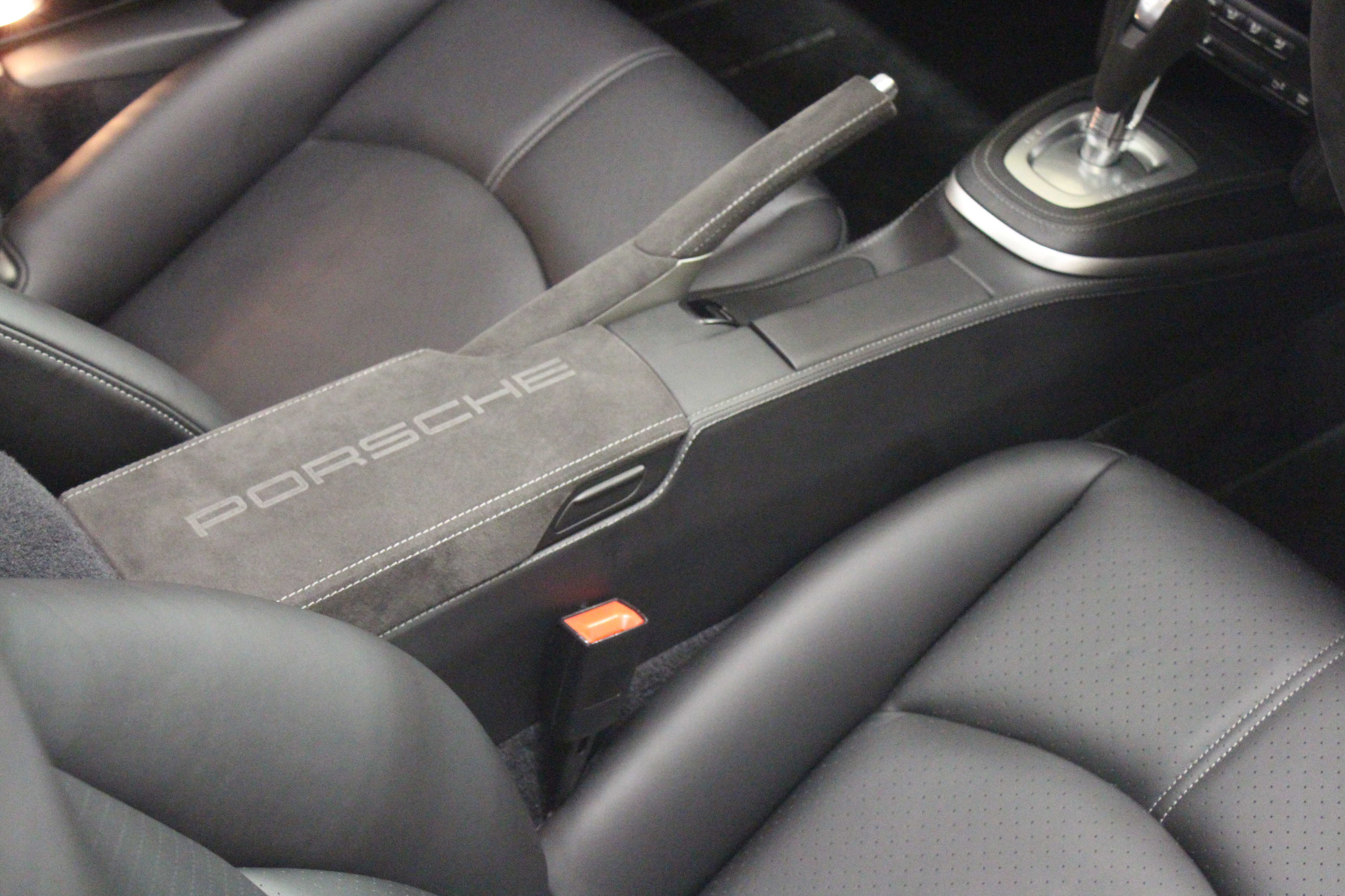 designls ltd porsche 911 997 leather centre console in black leather alcantara handbrake handle Porsche script alcantara armrest lid leather pdk surround